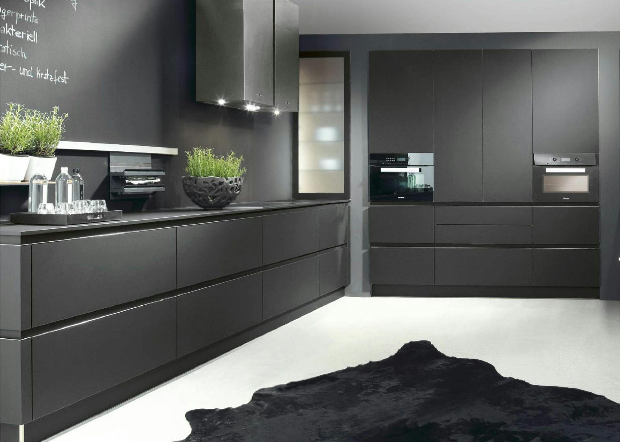 modern kitchen design with space grey wood and marbel with lights and elegant design with a lot of space and leather carpet and oven and microwave