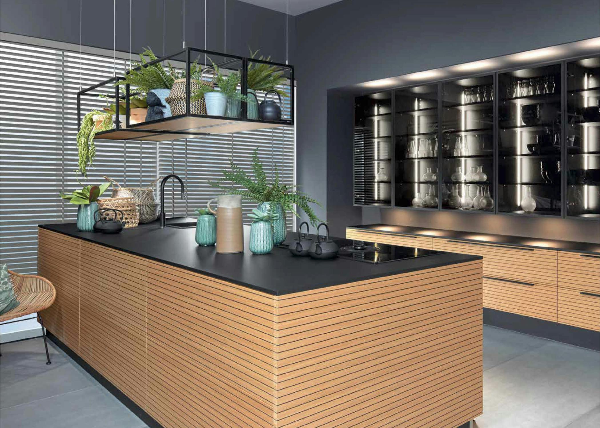 modern kitchen design with space grey wood and marbel with lights and elegant design with a tropical vibe and oven and microwave and big cabinet for glasses and plates